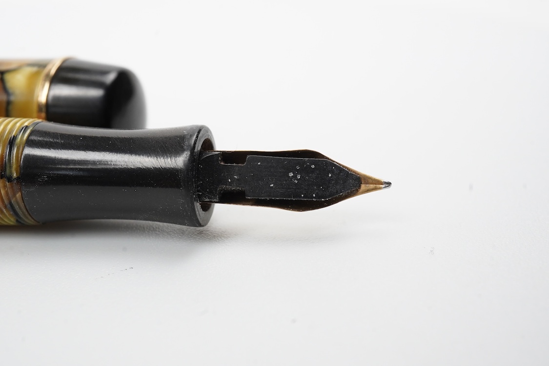 A Montblanc black and pearl fountain pen marked No.322 button filler